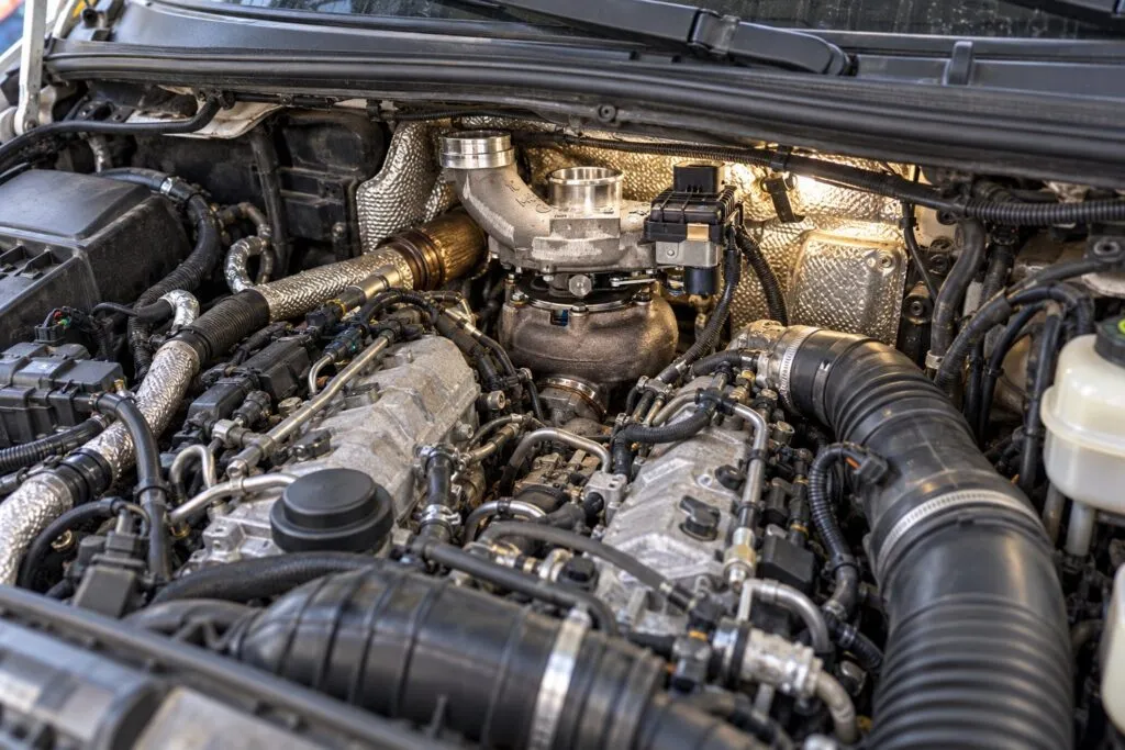 Garrett GT2056V Turbocharger: Mercedes OM642 & Dodge Sprinter Application Guide 2 GT2056V turbo installed at the rear of a Dodge Sprinter OM642 V6 engine bay